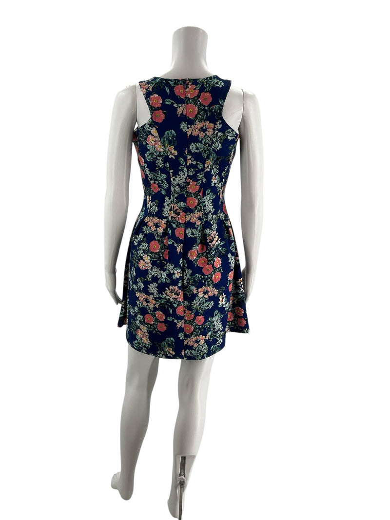 Back view of Pink Rose blue floral sleeveless A-line dress, showing keyhole detail and fitted waist, size M, pre-owned.