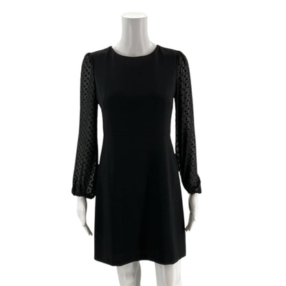 Front view of Ann Taylor Long Sleeve Black Solid Dress Size 0 Petite on mannequin, chic and timeless at Margaret&