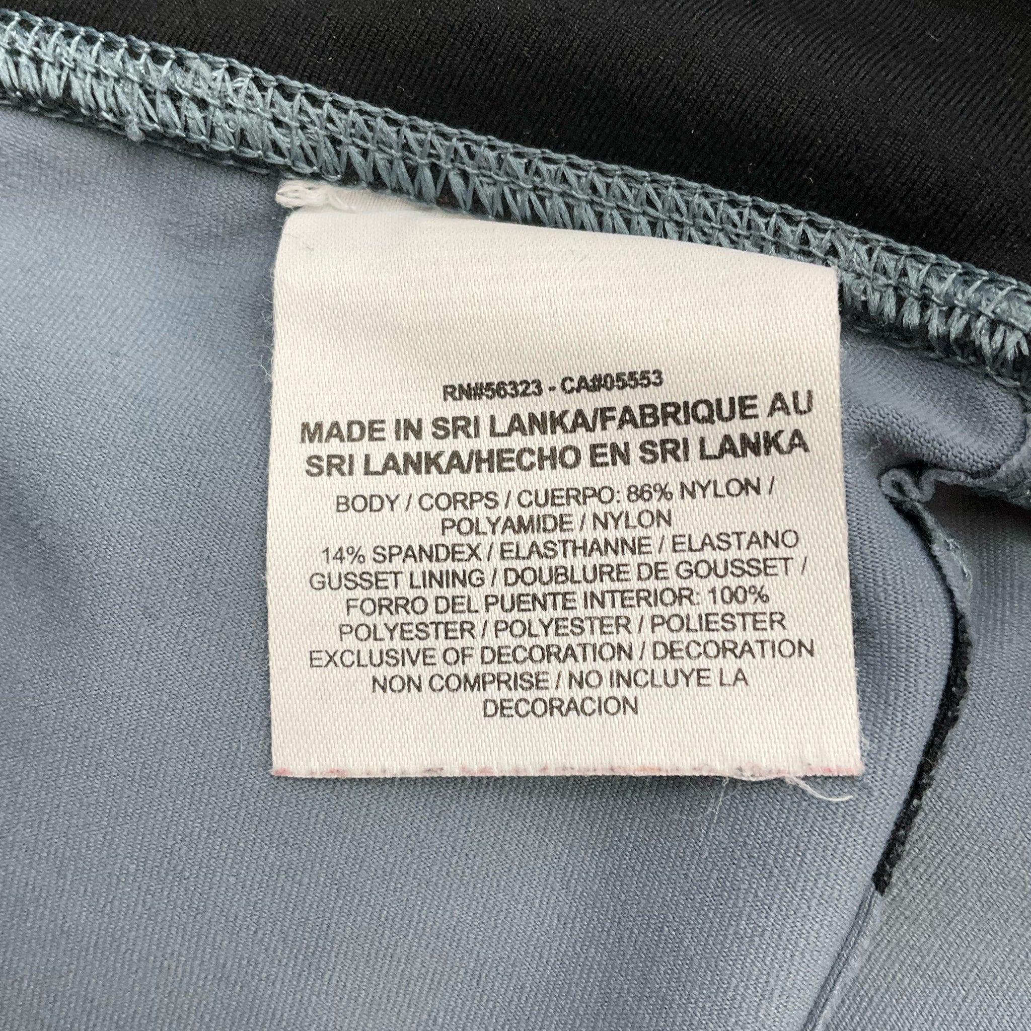 Nike blue and navy print pre-owned ladies activewear pants in size small displayed against a neutral background.