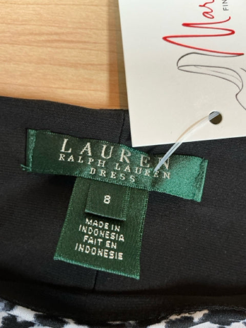 Brand and size label for Ralph Lauren Dress, size 8, made in Indonesia, attached to the neckline of the pre-owned dress.
