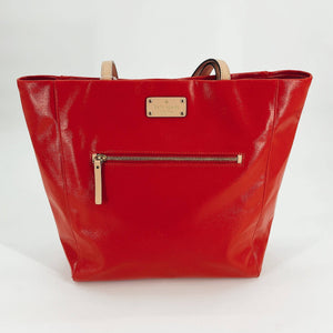 Kate Spade Red/Tan Solid Pre-Owned Tote Bag with front zipper pocket and gold logo plate, available at Margaret's Fine Consignments.