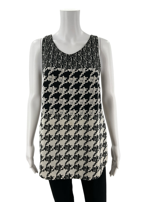 Front view of Cabi Pixel Houndstooth Tank Top Black & White Style 3090, size XS, featuring sleeveless design and bold pixelated pattern.