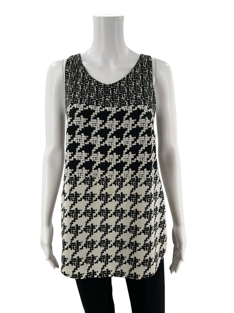 Front view of Cabi Pixel Houndstooth Tank Top Black & White Style 3090, size XS, featuring sleeveless design and bold pixelated pattern.