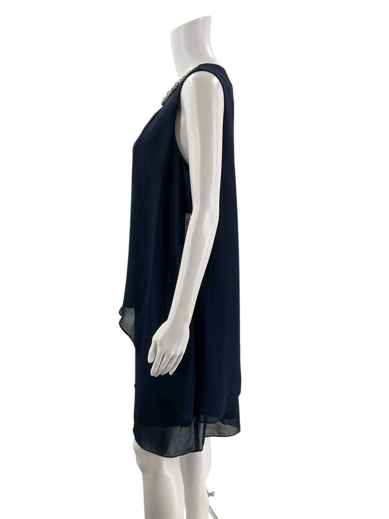 Side profile of SLNY navy sleeveless cocktail dress, size 10, showcasing layered chiffon and elegant shift silhouette.