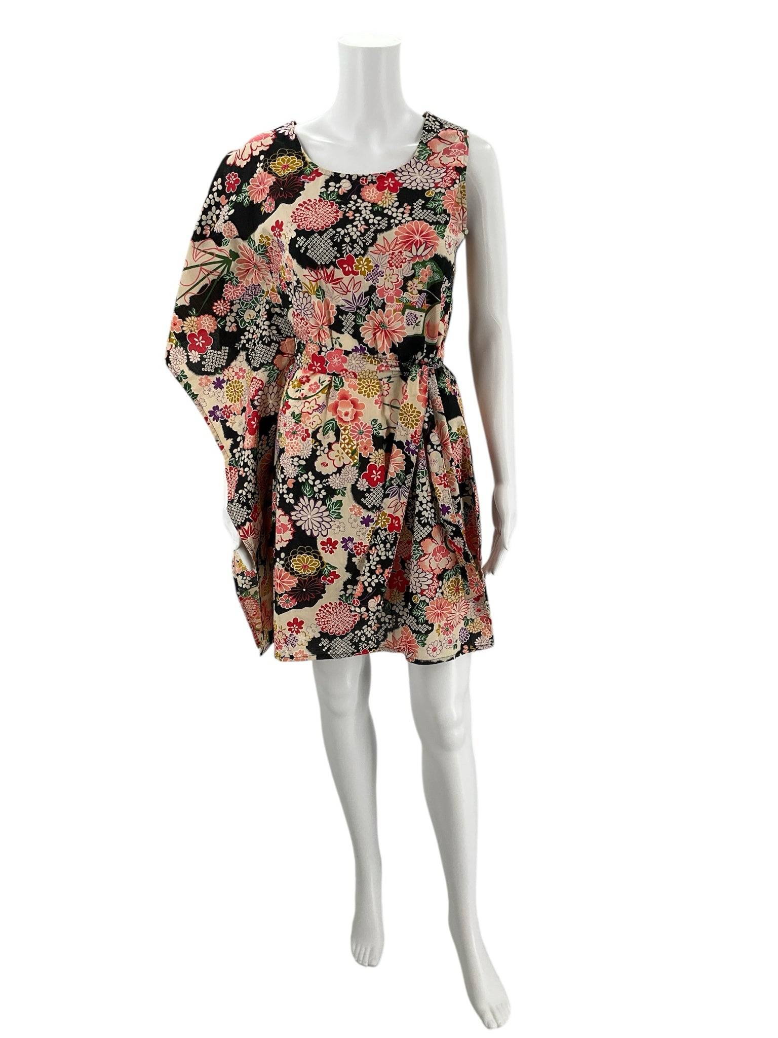 100% Pirata 1 Sleeved Mini Dress Size S/M with bold floral print, available at Margaret’s Fine Consignments. Artistic casual style for women.