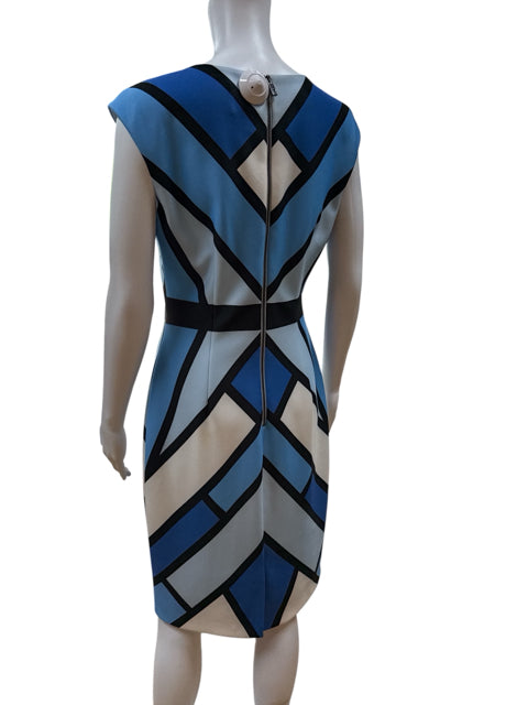 Back view of Vince Camuto color block sheath dress in size 6, featuring a full-length zipper and geometric pattern for a sleek, professional look.