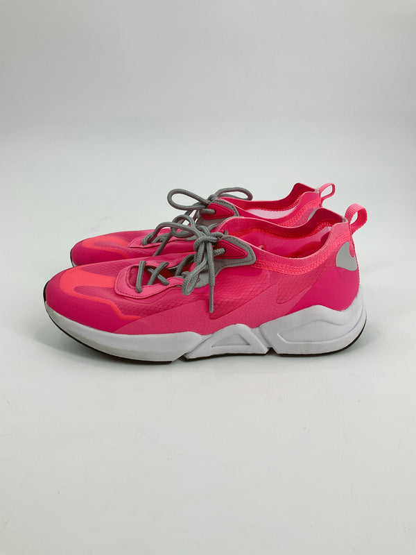 Fabletics pink pre-owned ladies sneakers size 8.5 with gray laces and white soles, side view showcasing athletic design for casual wear.