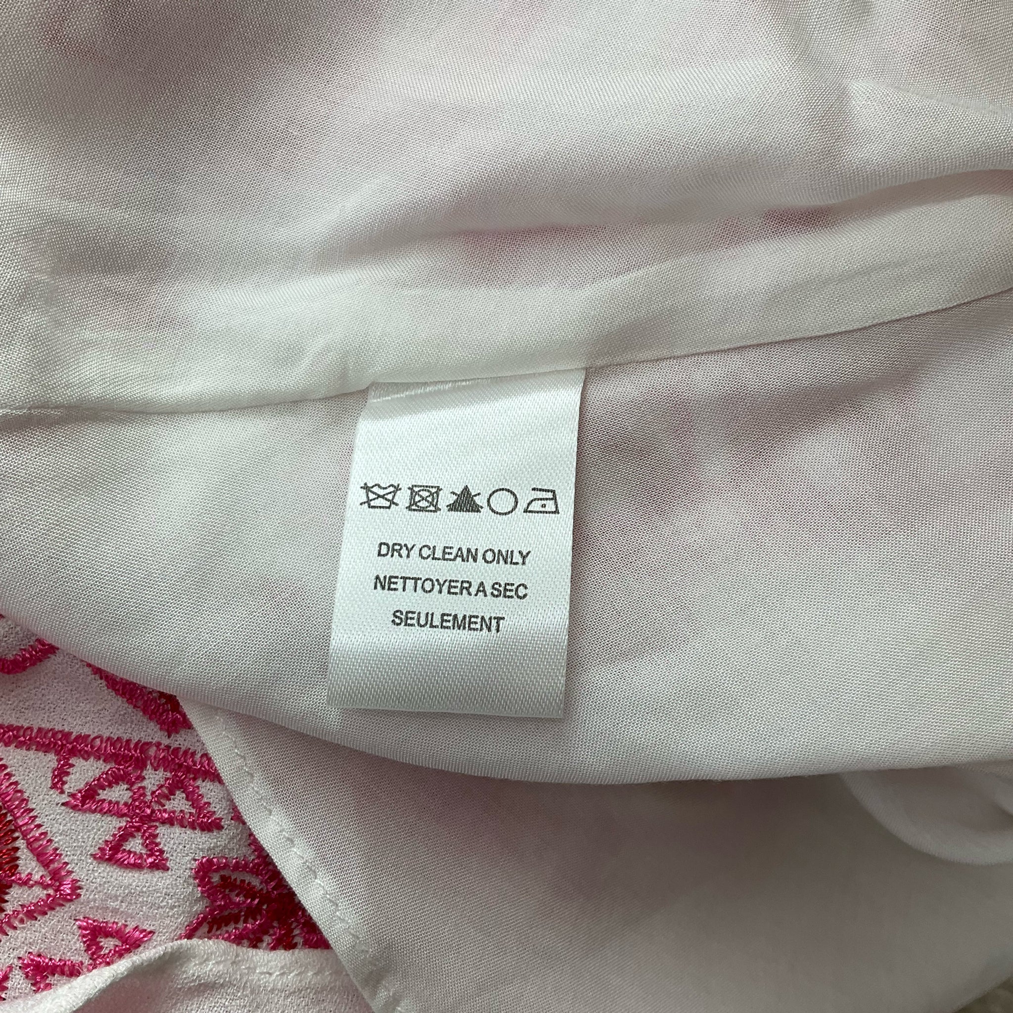 Care label of Hale Bob White/Pink Print Dress - Size Large indicating dry clean only instructions for garment maintenance.