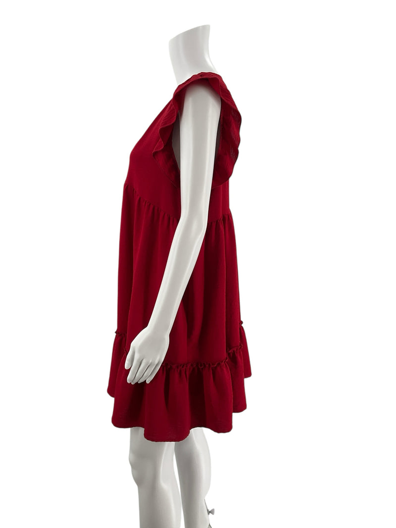 Side profile of Altar'd State red tiered babydoll dress on mannequin, showing flutter sleeves and flowy silhouette, size large.
