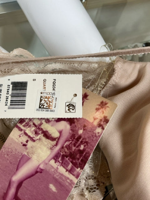 Close-up of original tags on Emerald Sundae tan lace dress, confirming it is new with tags and size small.