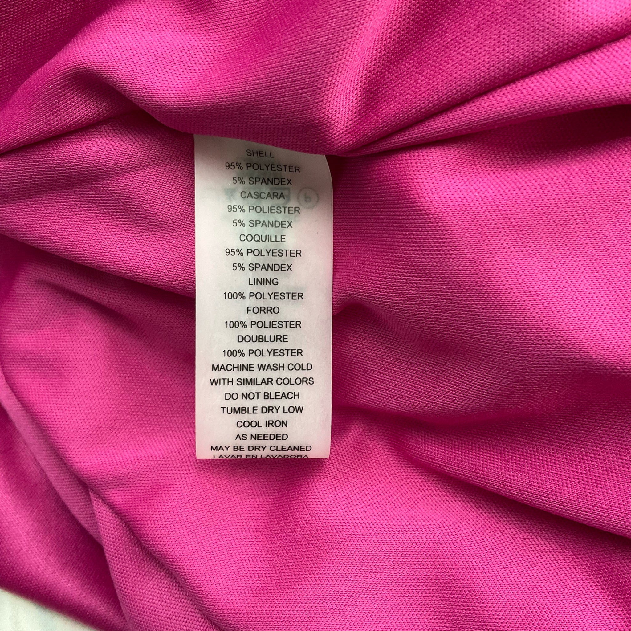 Fabric content tag of Vince Camuto Pink/Navy/Orange Print Dress - Size 4 showing polyester and spandex blend. Machine washable and pre-owned.