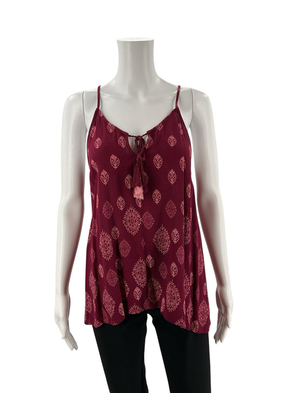 Front view of Luq maroon/pink bohemian tank top on mannequin, showcasing sleeveless cut, v-neck with tassel tie, and flowy rayon fabric.