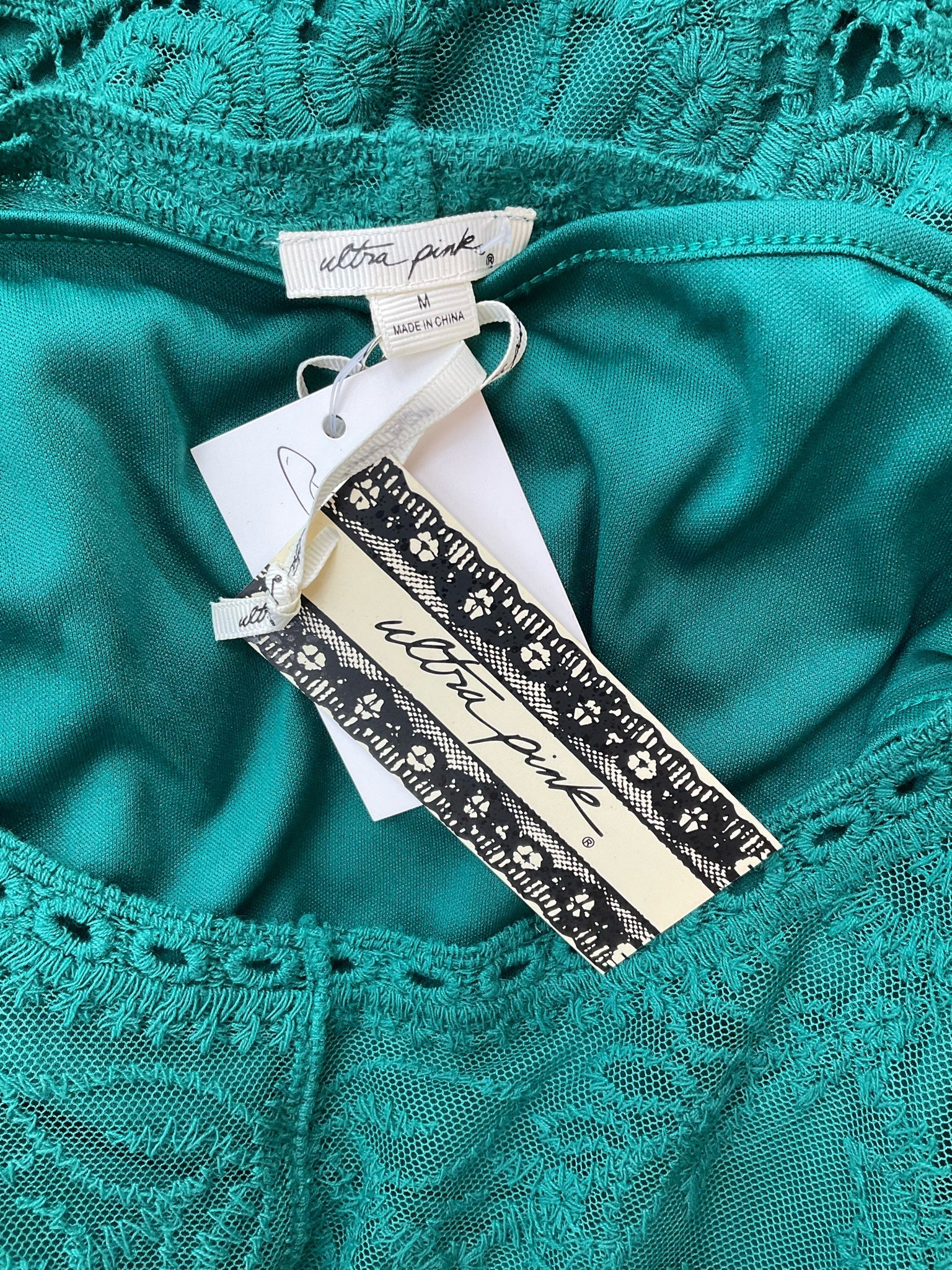 Ultra Pink boho tunic top in green lace with bell sleeves, size medium, featuring a vibrant pink design.