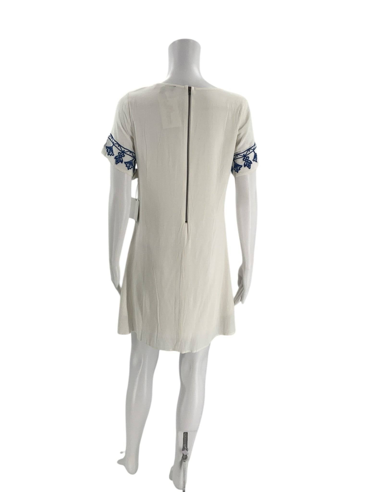 Back view of Lulus crew neck mini dress in white with blue embroidery, size small, featured at Margaret’s Fine Consignments.