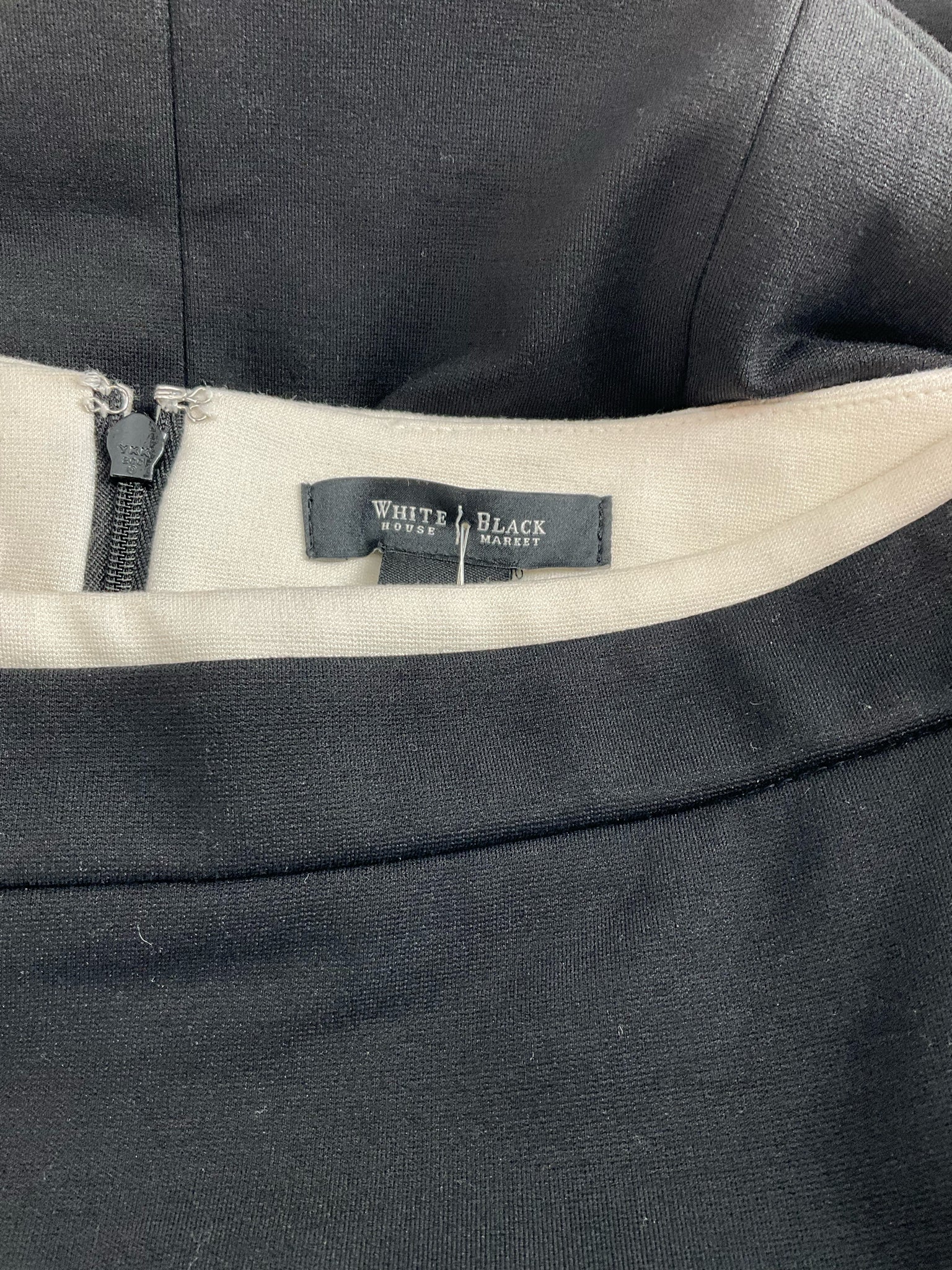 White House Blk Mkt - Black/Cream Solid Pre-Owned Ladies Skirt - Size 0 - Margaret’s Fine Consignment