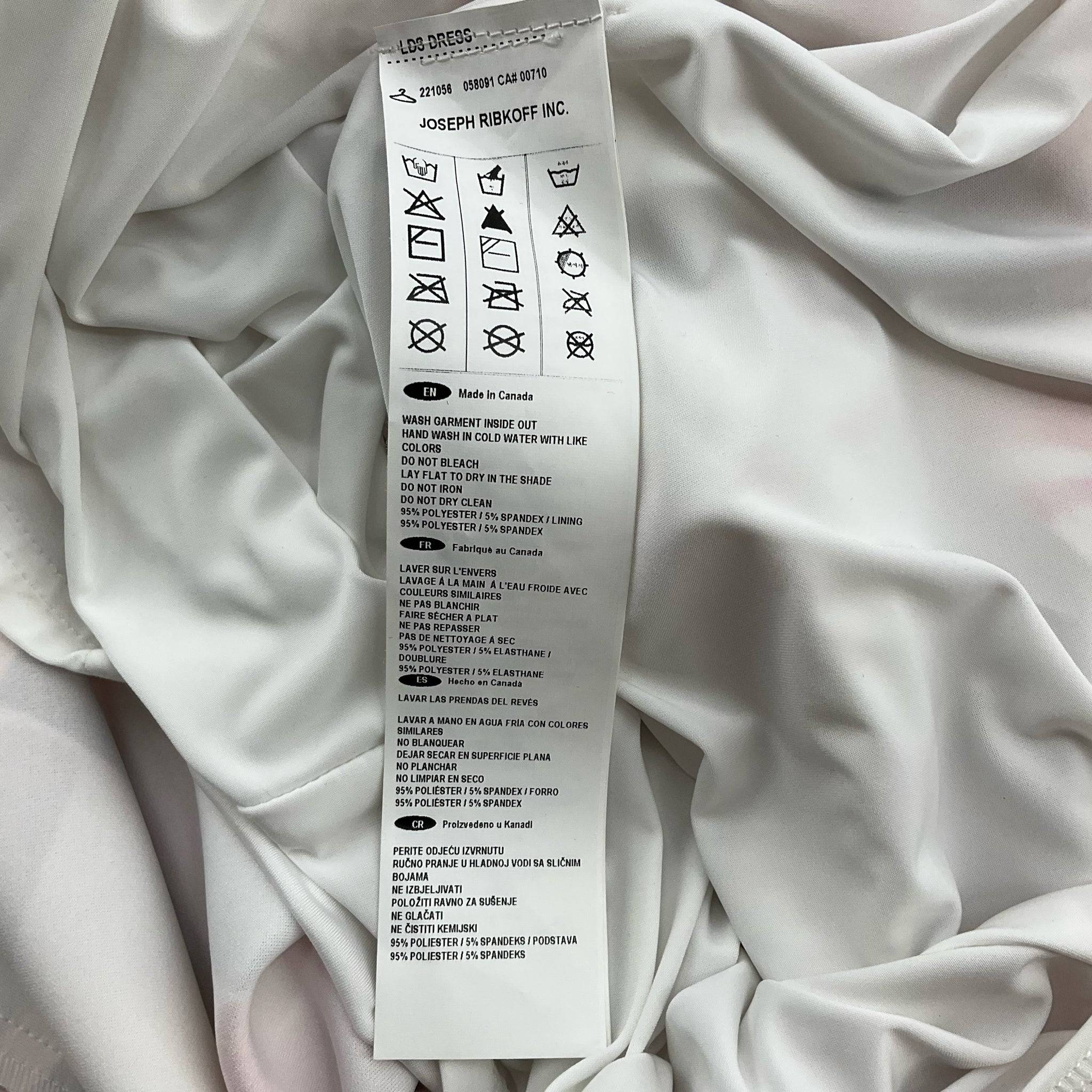 Fabric care label of Joseph Ribkoff pink and white print knee-length dress size 6, highlighting material and washing instructions.