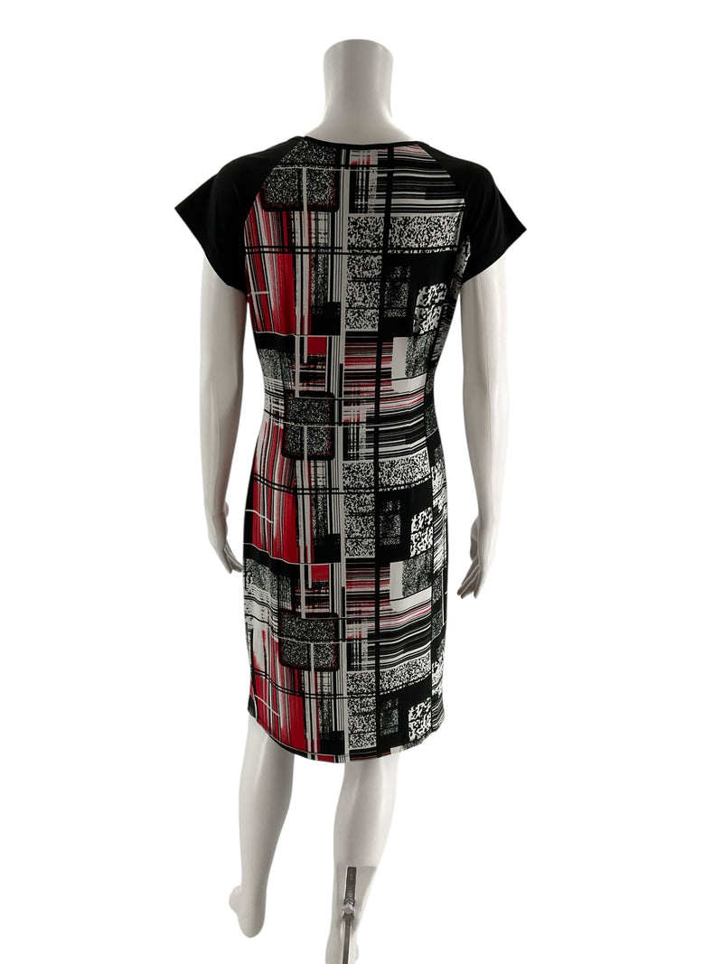 Back view of Dusak Designs knee-length shift dress featuring bold abstract print in black, white, and red, size large, Canadian made.