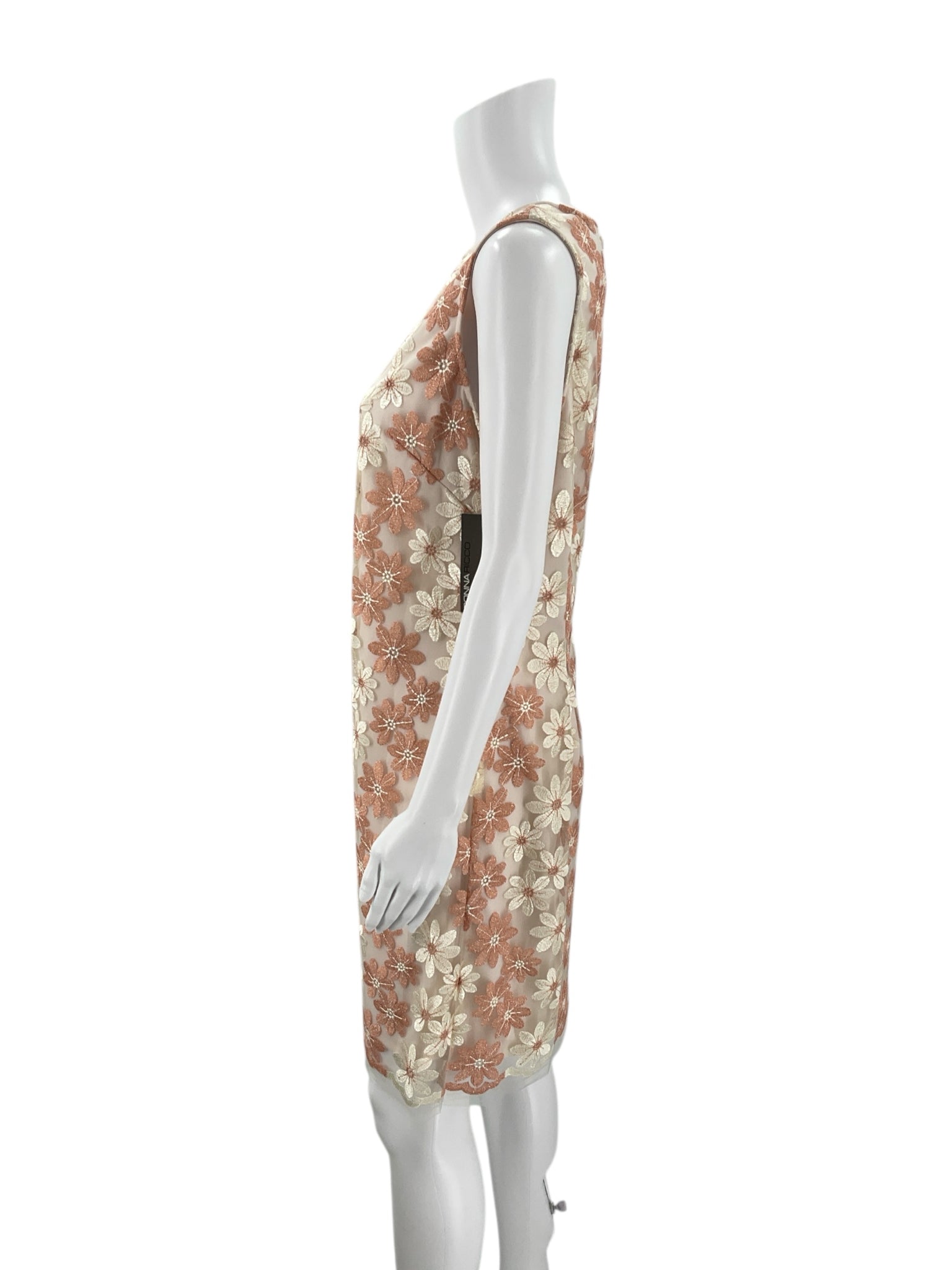 Side profile of Donna Ricco Peach/Cream Floral Dress - Size 10, highlighting the sleeveless cut and elegant floral detailing.