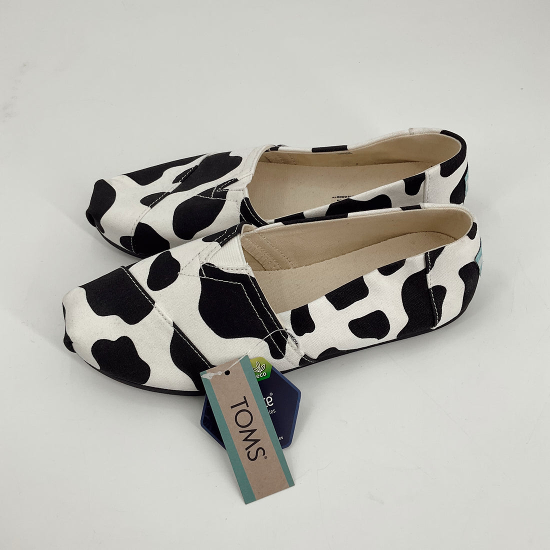 Toms White/Black Cow Pre-Owned Ladies New With Tags Slip On - Size 8 - Margaret’s Fine Consignment
