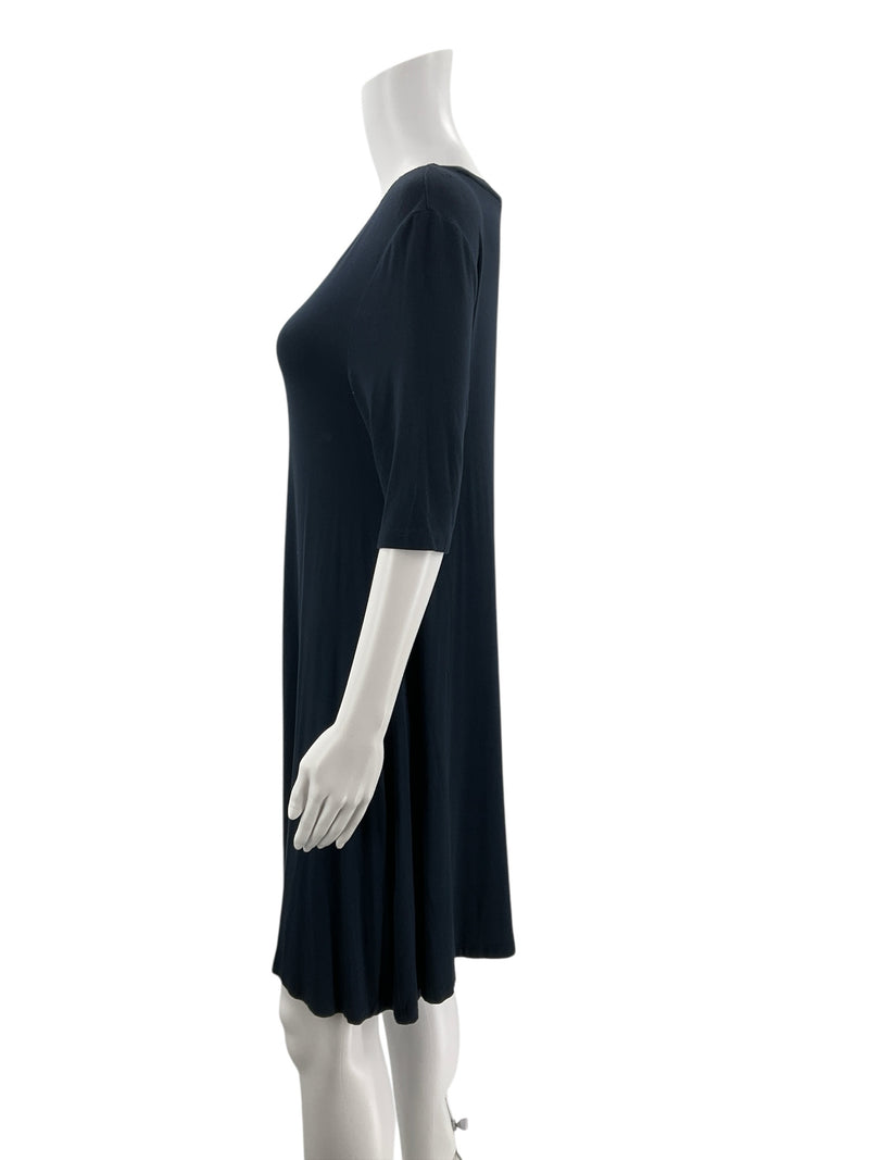 Side profile of C&C California navy casual dress on mannequin, showing short sleeves and soft stretch fabric drape.
